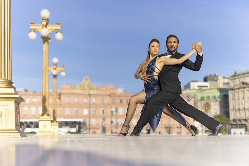 couple in tango dancing pose outdoors