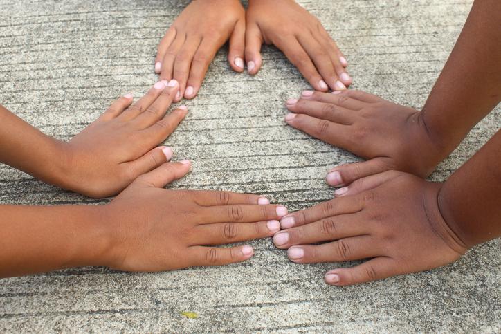 black young hands on concrete ground