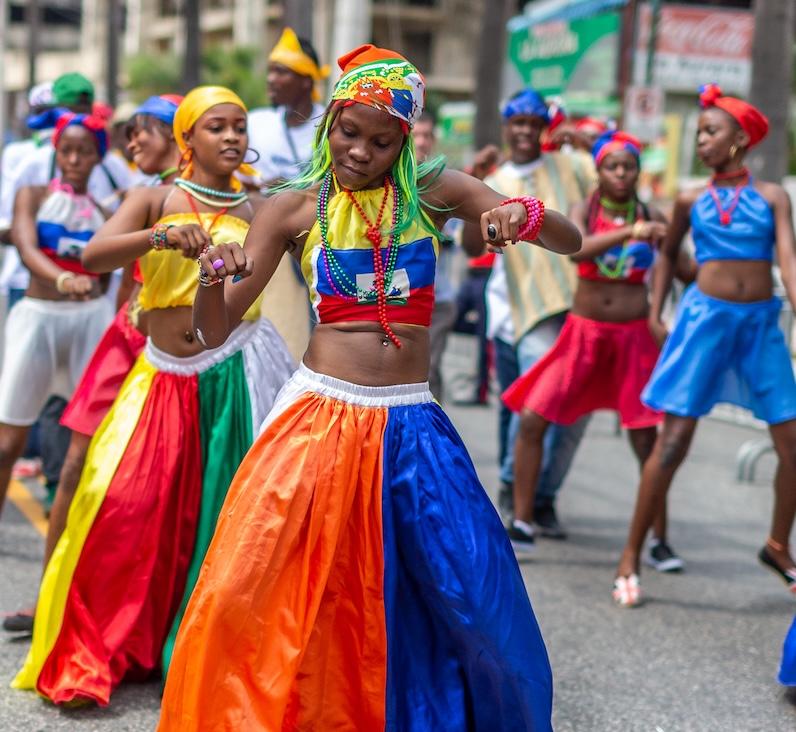 haitain dancers in street perform