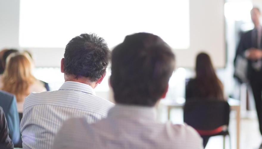 backs of students in a classroom