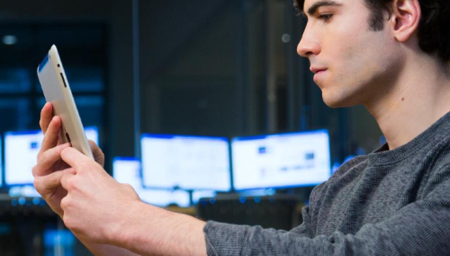 student reading a booklet