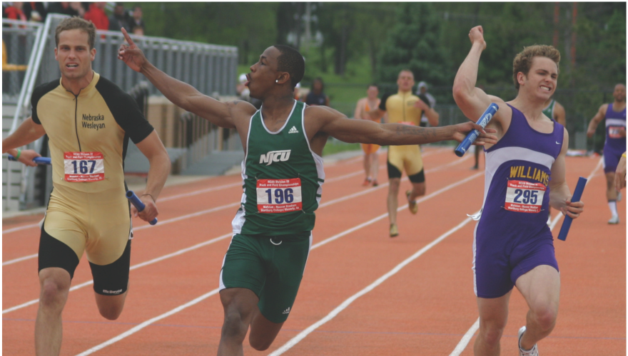 NJCU men's track runner in the lead of a relay race.