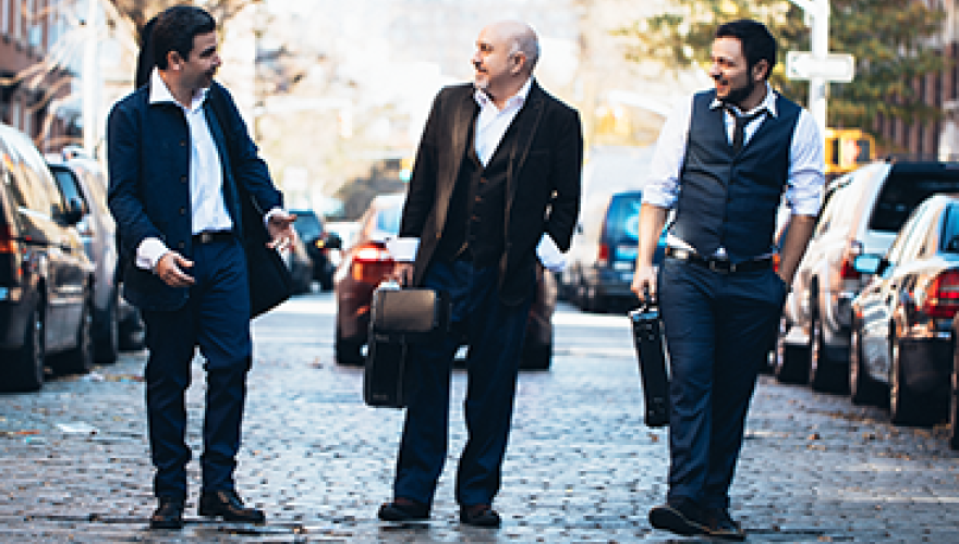 3 musicians walking in the street