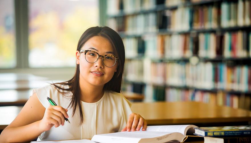 student studying in the library