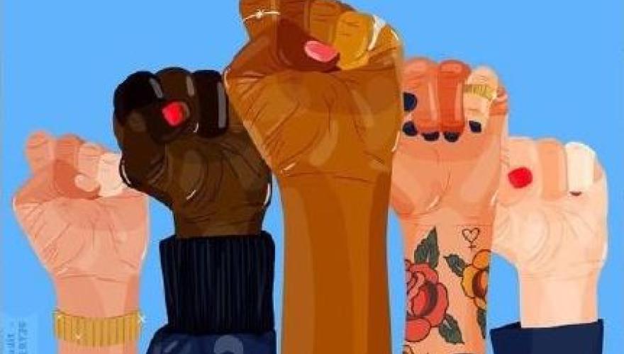 Multicultural fists in the air.