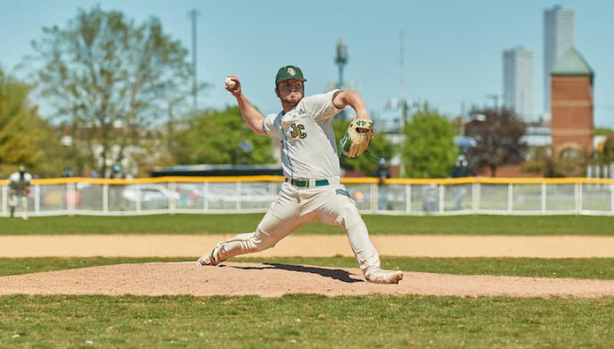 male throwing baseball open field