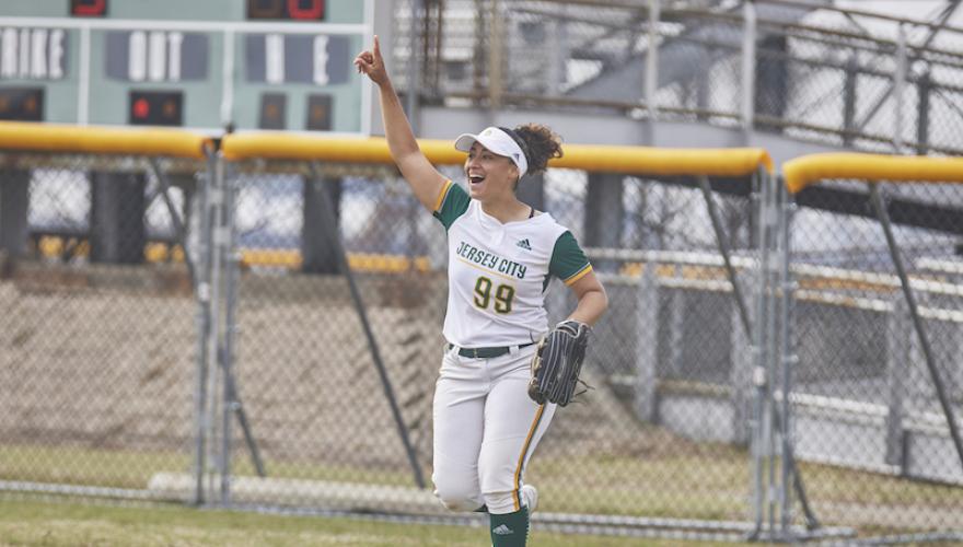 softball woman player arm pointing up