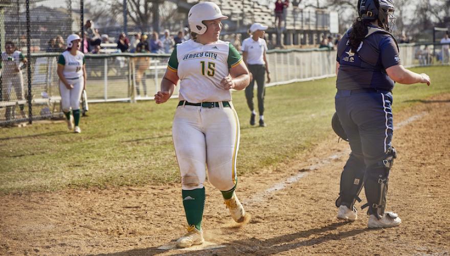 WOMAN ON SOFTBALL FIELD WITH OTHER PLAYERS