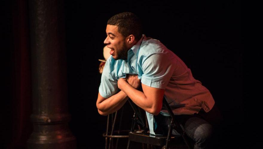 Actor leaning on chair