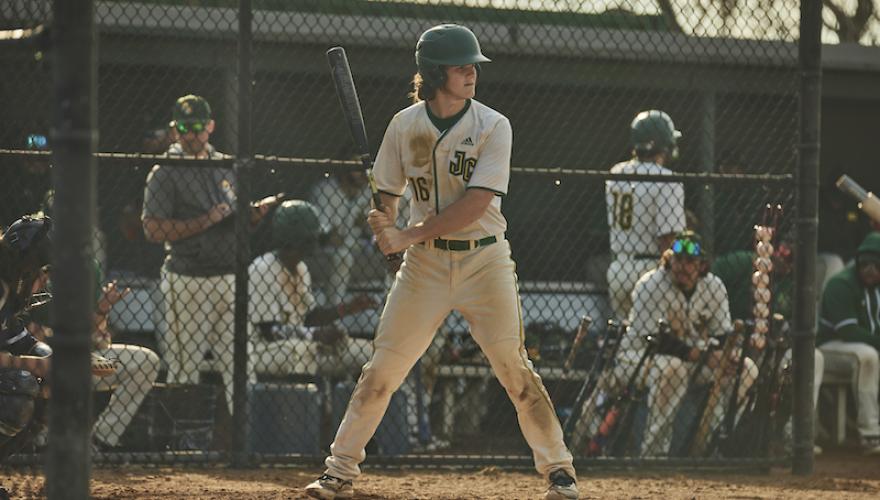 BASEBALL PLAYER HOLDING BAT FOR PITCH