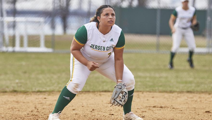 WOMAN SQUATTED DURING SOFTBALL GAME
