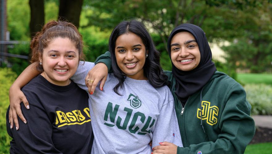 Three NJCU students wearing spirit gear