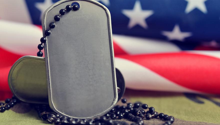 MILITARY TAG WITH AMERICAN FLAG BEHIND