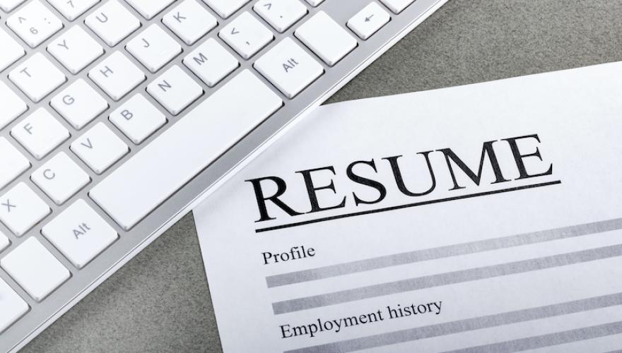 RESUME PAPER WITH KEYBOARD ABOVE IT