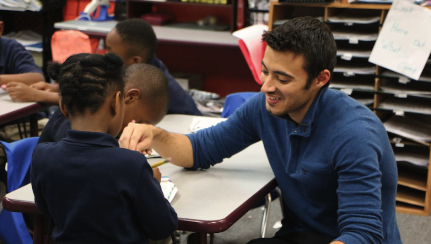 MAN WORKS WITH SMALL CHILDREN