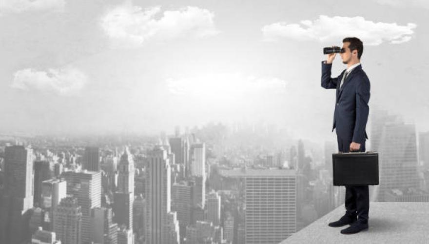 BUSINESSMAN WITH BINOCULARS SKY LEVEL