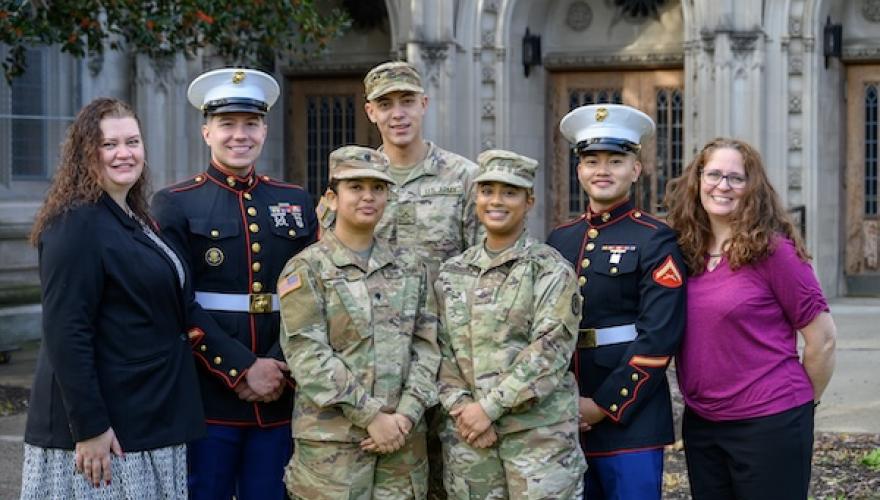 MILITARY STAFF POSED WITH 5 STUDENTS