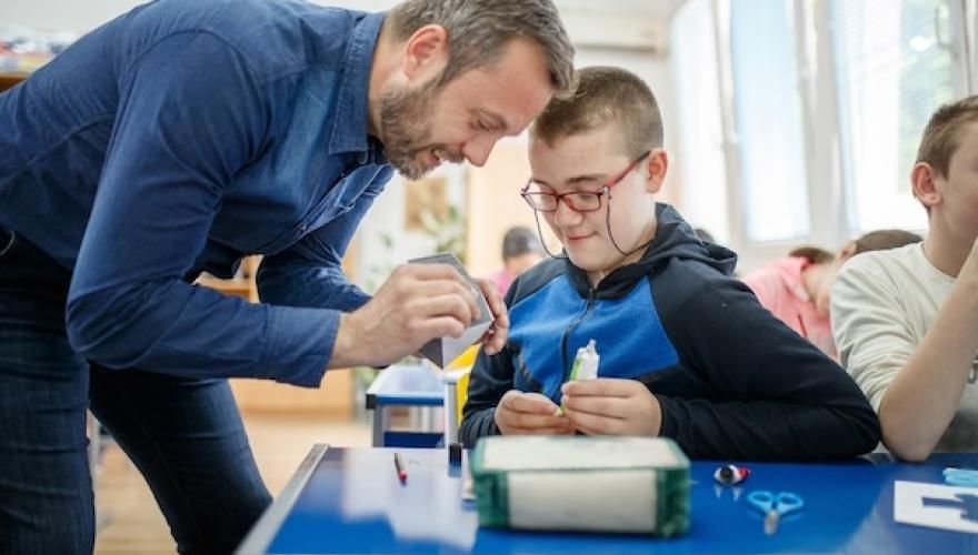 MAN AND BOY CREATE AT TABLE
