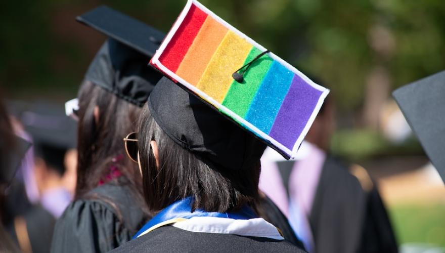 GRADUATE WITH LGBT FLAG ON CAP