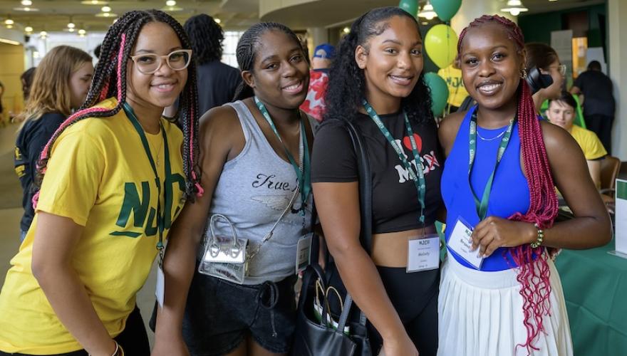 FOUR BLACK FEMALE STUDENTS POSE