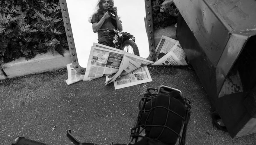 MAN WITH CAMERA IN MIRROR