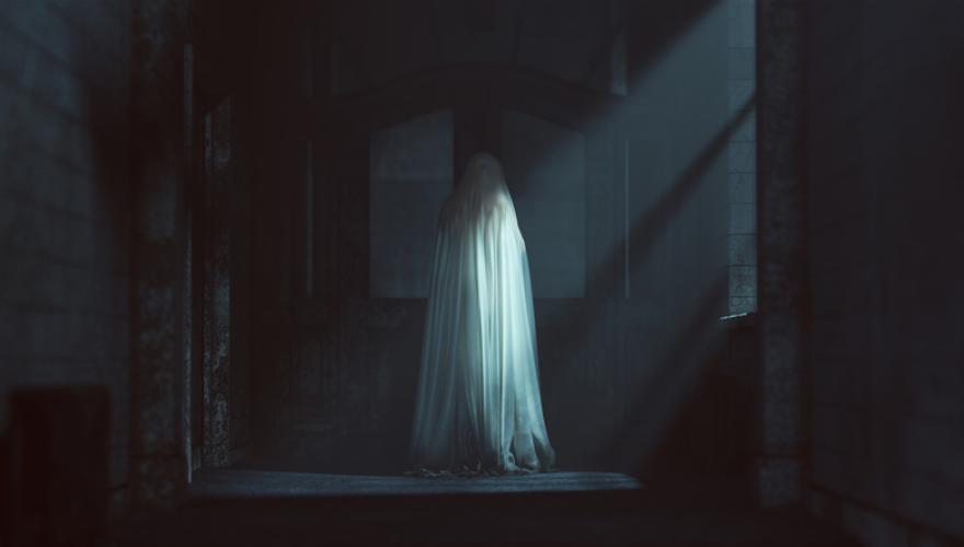 GHOST IN DARKENED ROOM