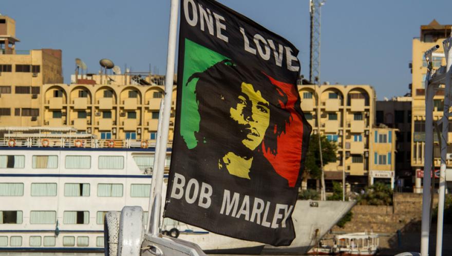 one love bob marley flag on city street