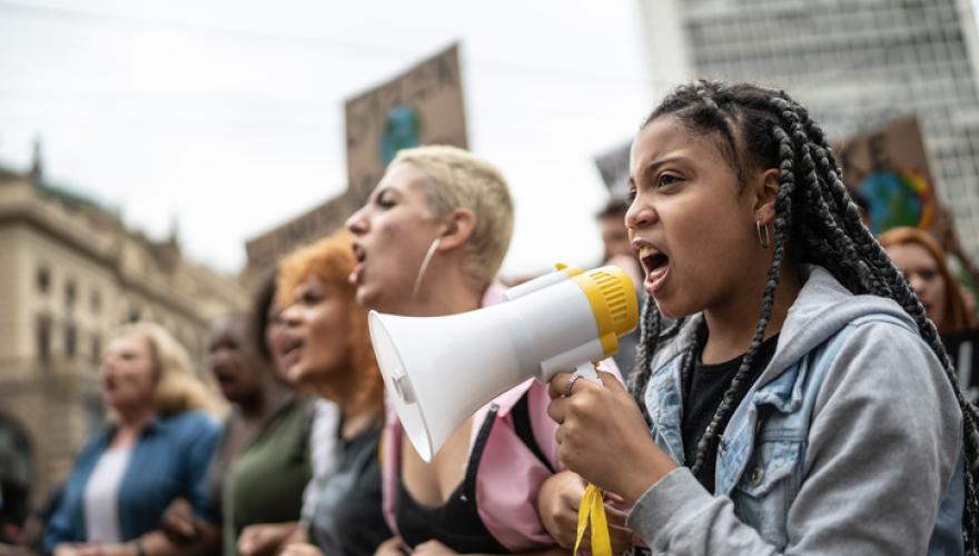 youth protesting with megaphone
