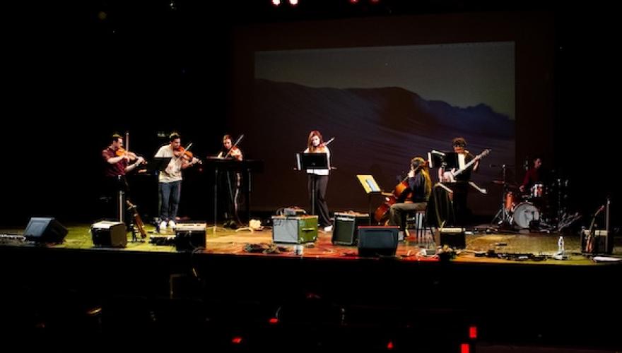 multi-strings students perform on stage