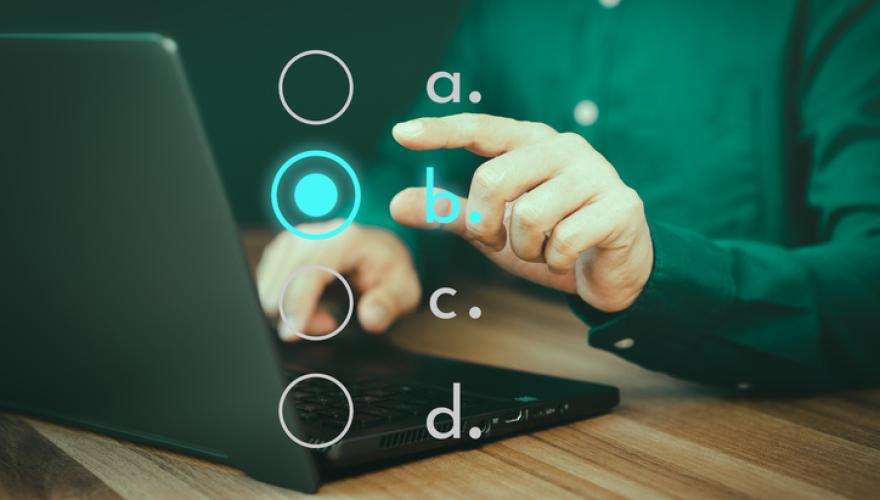 hands and laptop, taking an exam