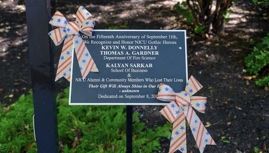 9-11 plaque with bow tie flags