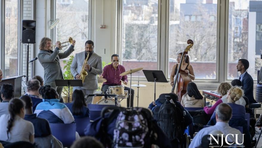 musicans play in library with audience
