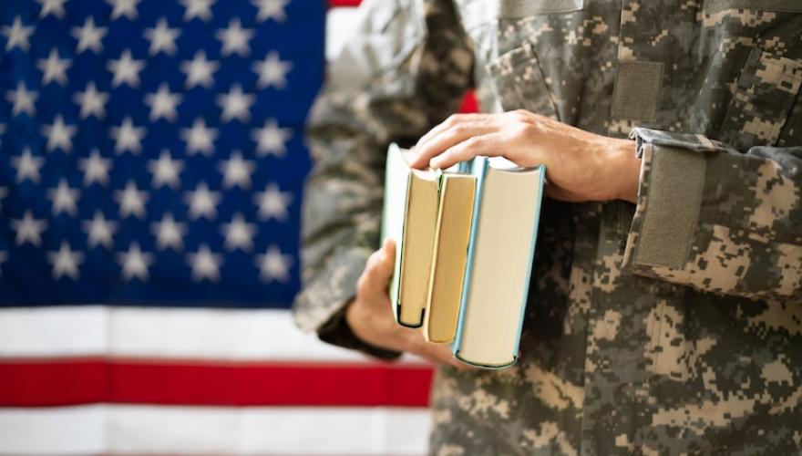 military uniformed person with books