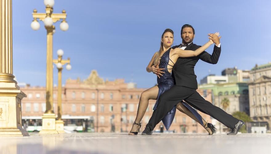 couple in tango dancing pose outdoors