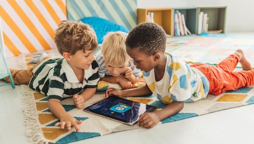 small children play with tablet