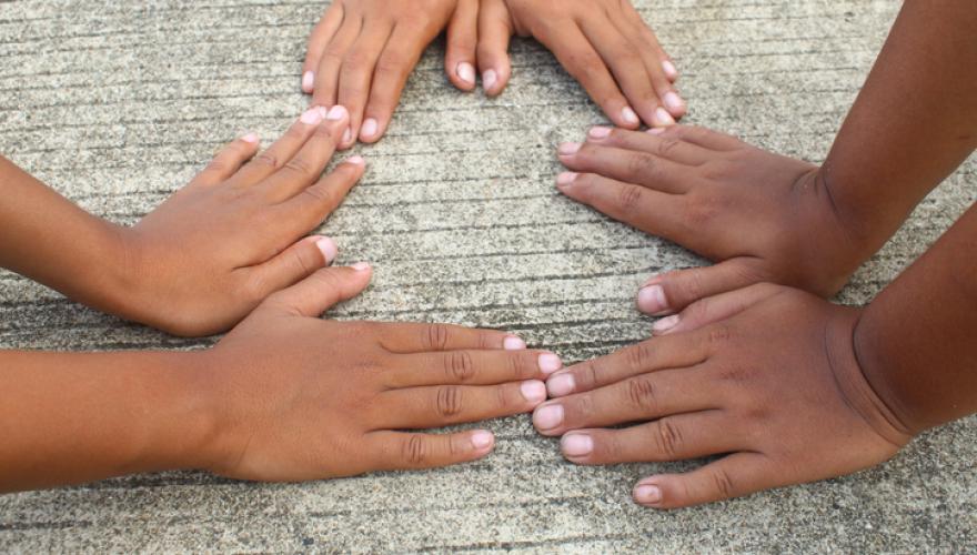 black young hands on concrete ground