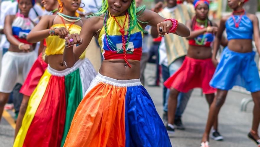 haitain dancers in street perform