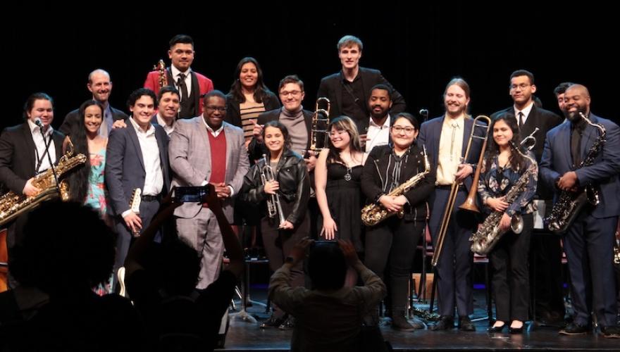 jazz musicians pose on stage