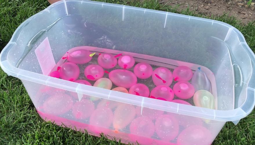 WATER balloons in plastic bin