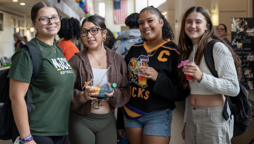female students pose with mocktails