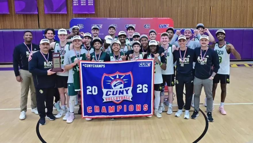 The men's volleyball team poses with a championship banner after defeating Baruch, 3-1, to win its first CUNYAC conference crown on April 10.