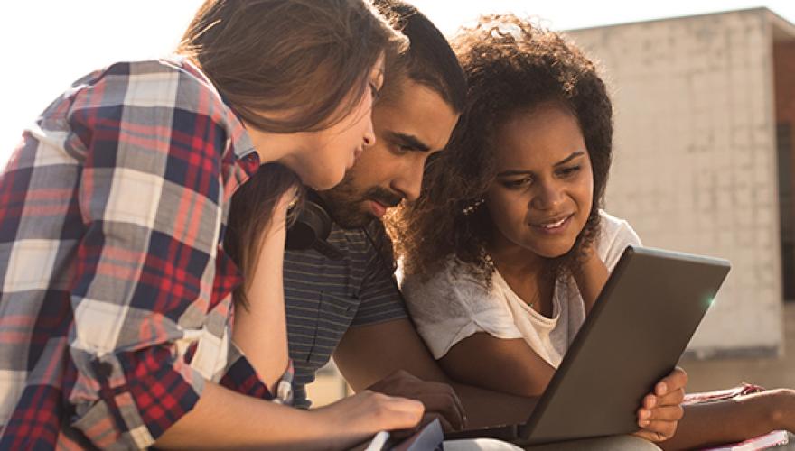 three students studying