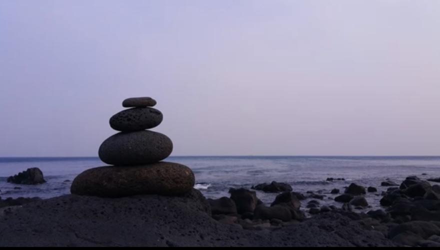 Image of rocks on a beach during sunset