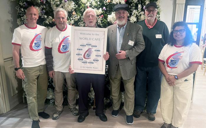 AFT leaders at a recent event. AFT Local 1839 Bill Calathes holding a sign in the middle.