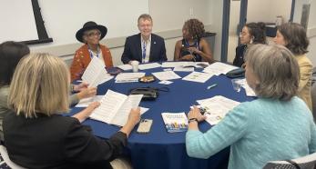 fulbright conference group at table