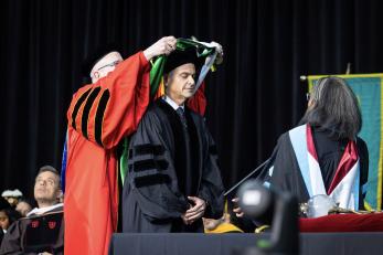 Jorge A. Plasencia being hooded with an honorary degree by David S. Birdsell, Ph.D., Provost and Senior Vice President for Academic Affairs at Kean University and Chief Academic Officer at NJCU.